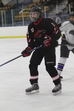 Junior Brett Best skates on the ice during a game. 