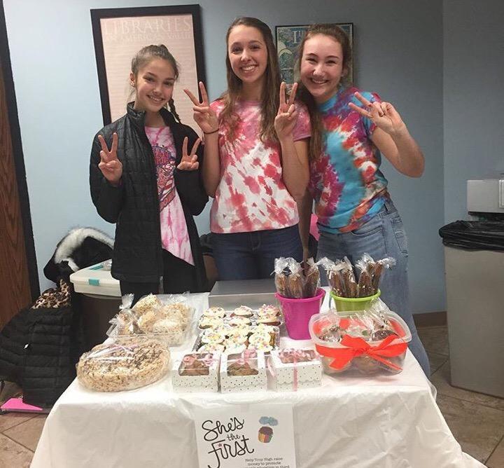 Junior Katie Ferriby, freshman Lauren Monaghan and junior 
Megan Monaghan bake food for a fundraiser.  