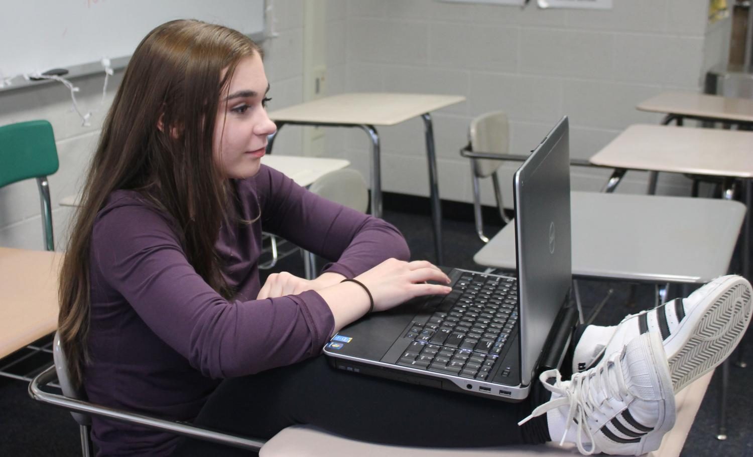 Junior Danielle  Boyer works on a project.