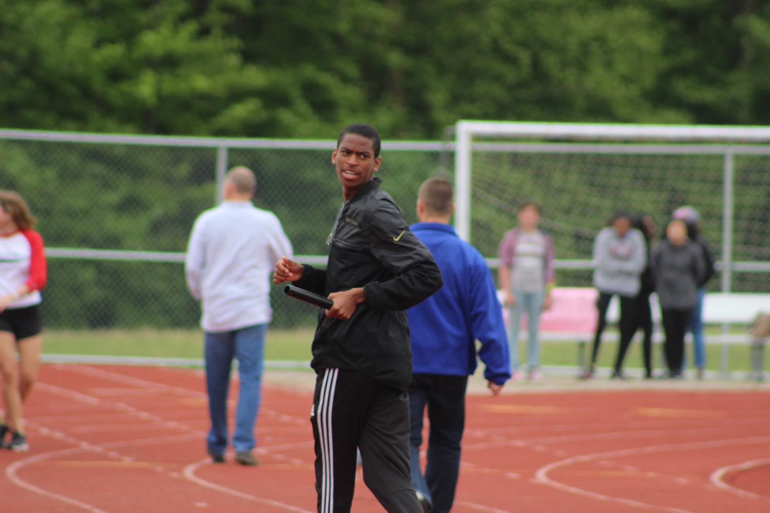 Senior Brandon Davis practices on the track before the spring pep rally on Friday, May 19.