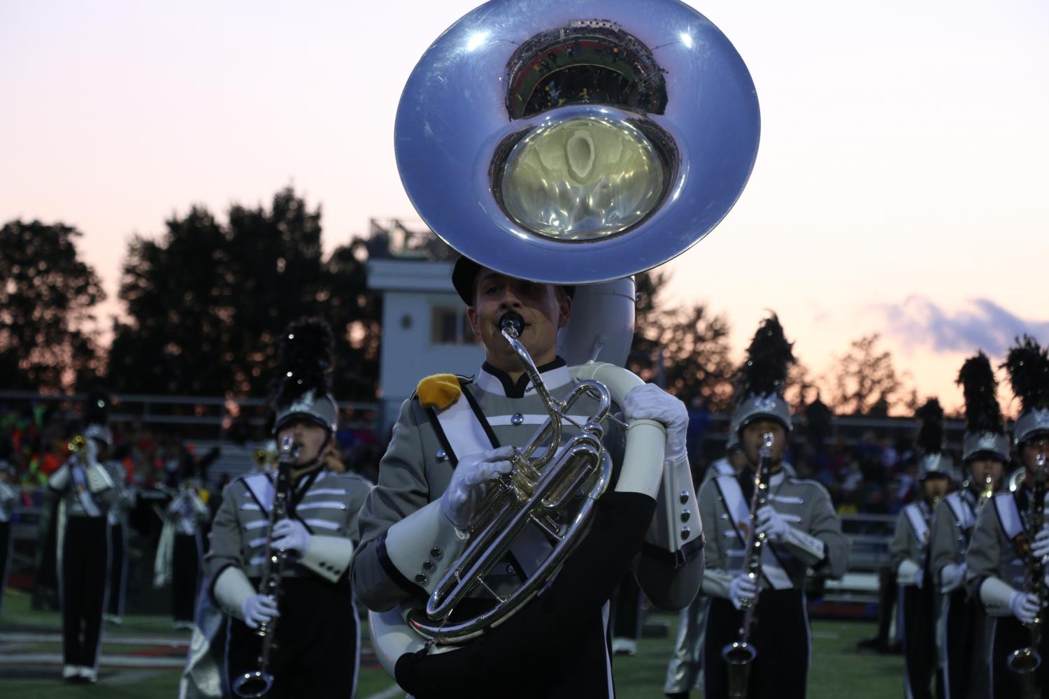 Junior Zenon Stephien plays the sousaphone for the marching band. 