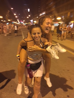 Seniors Rebecca Prater and Catherine Manceor in the streets of Lollapalooza music festival in Chicago, Illinois.