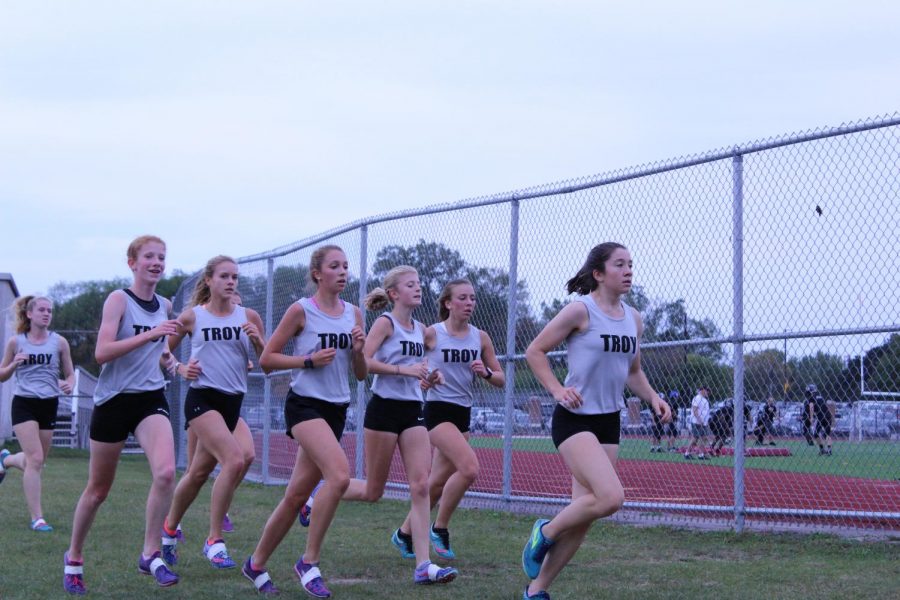 The girls on the cross country team run a meet during the 2017 fall season. 