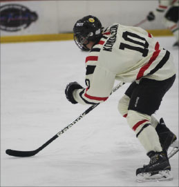 Senior Chris Kondoleon plays during a hockey game.