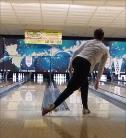 Junior Nick Gajewski bowls at bowling tryouts.