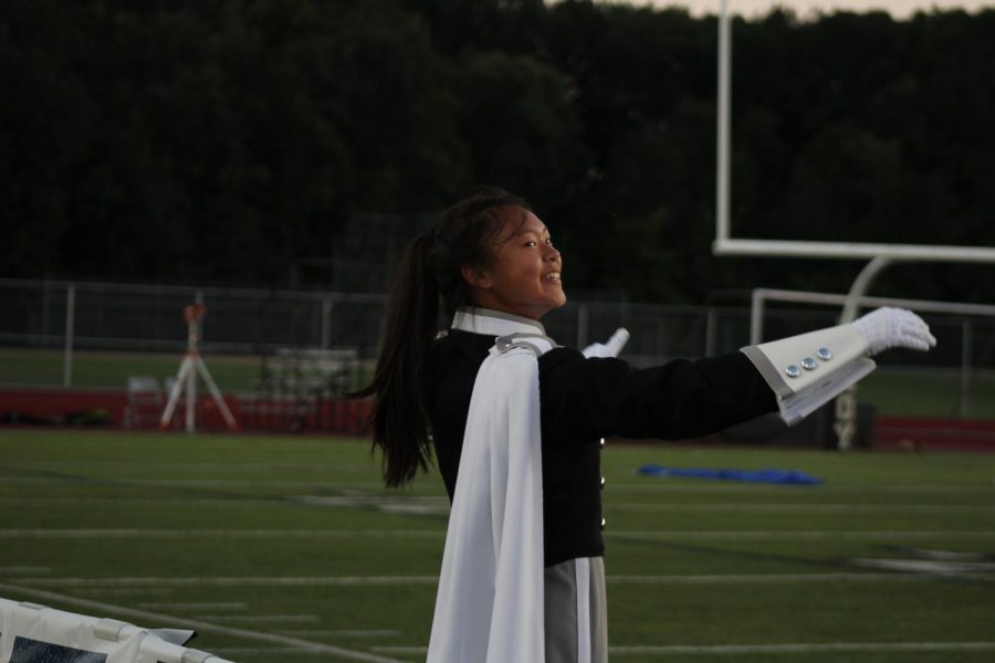 Junior Teresa Chen conducts the band while looking at senior drum major Nabeel Mohammad.