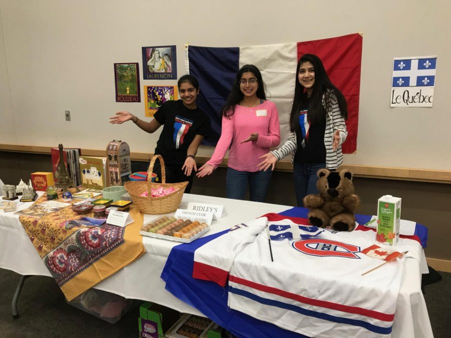 French Club with their table representing France and the French-speaking Canadian province of Quebec.