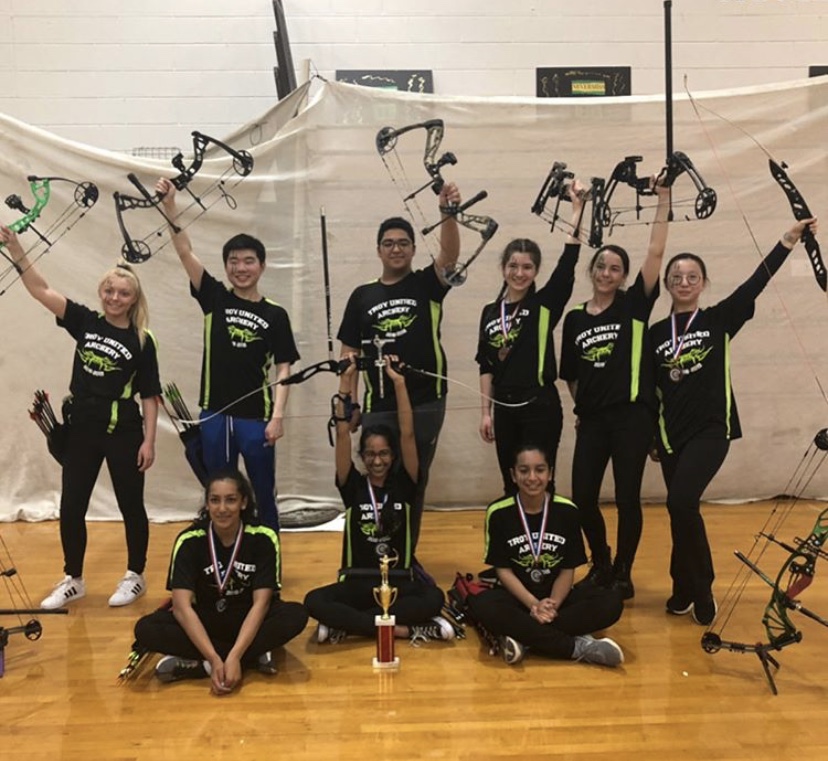 The Troy High Archery Club poses with bows in hand.