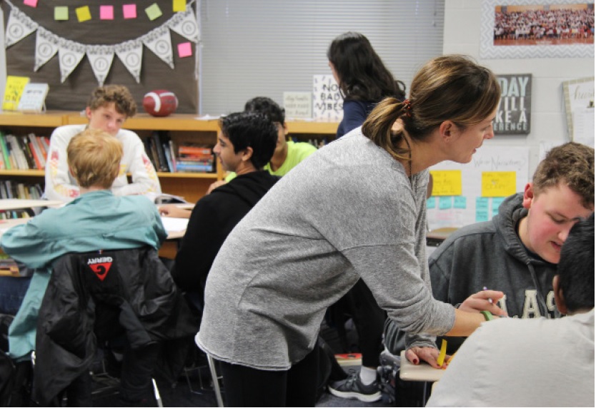 English Teacher Jodie Duda assists students during their class time.