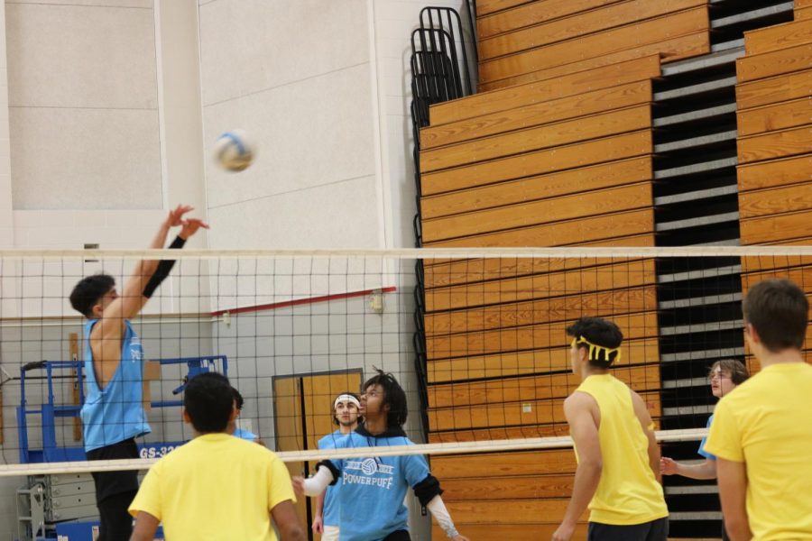  A player from Blue Thunder slams the volleyball over the net.