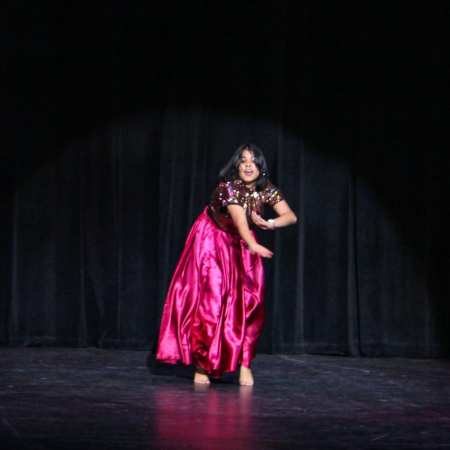 Prisha Kumar dances, her pink skirt flowing. 