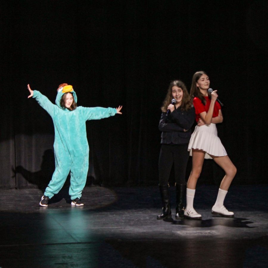 Dressed as Perry the Platypus, Candace Flynn and Vanessa Doofenshmirtz, Nora McLachlan, Naomi Player and Reagan Feld perform Busted from the hit TV show, Phineas and Ferb.